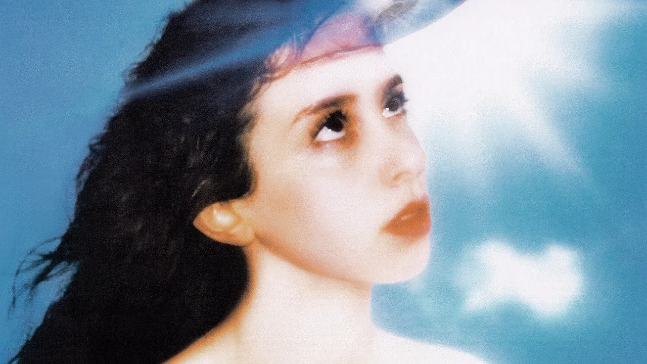 Album cover for Imaginal Disk: band member Mica Tenenbaum looking up with a CD being inserted into her forehead