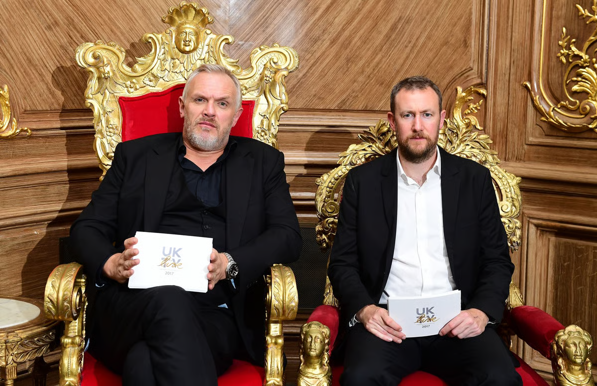 Promotional image for Taskmaster: Greg Davies and Alex Horne sit on opulent gold chairs