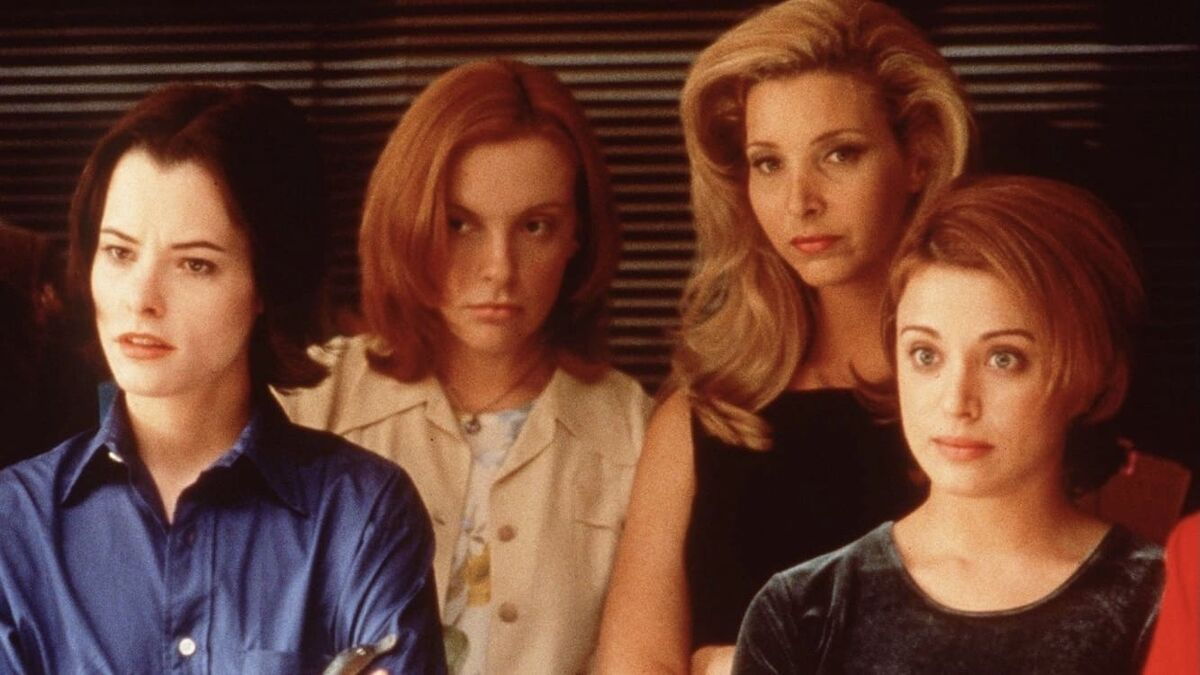 Still image from Clockwatchers (1997): actors Parker Posey, Toni Collette, Lisa Kudrow, and Alanna Ubach stand in a row