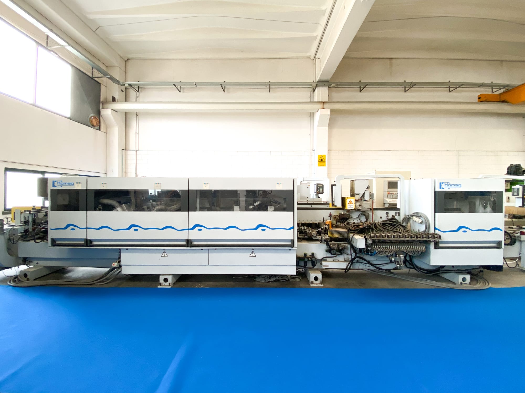 mașină de aplicat cant unilaterală second-hand Homag KL QA S2, cunoscută pentru robustețea și fiabilitatea sa 