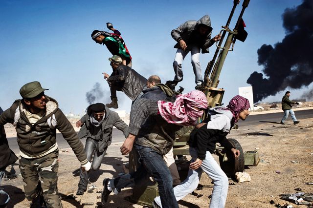 1st prize Spot News Singles. Yuri Kozyrev, Russia, Noor Images for Time. On revolution road, Ras Lanuf, Libya, 11 March 2011 Yuri Kozyrev, Russia, Noor Images for Time